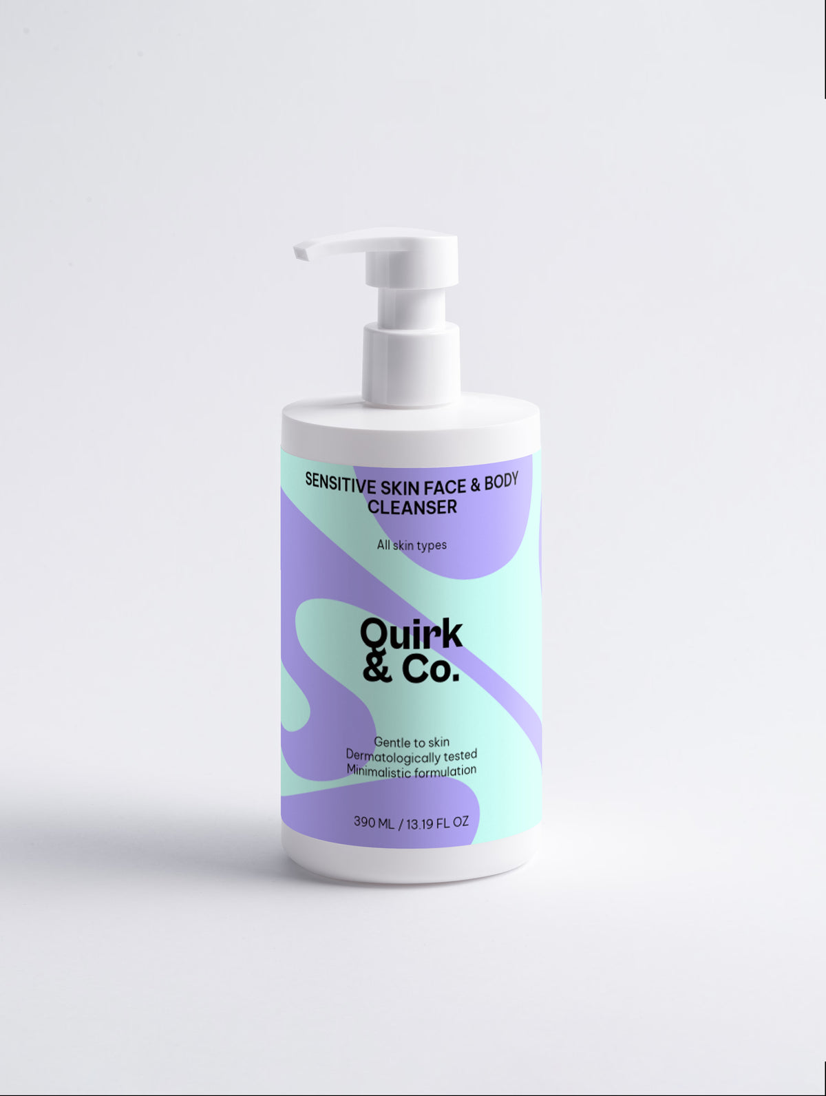 A white pump bottle of Quirk & Co. Sensitive Skin Face & Body Cleanser with a pastel purple and mint green label, set against a clean white background.